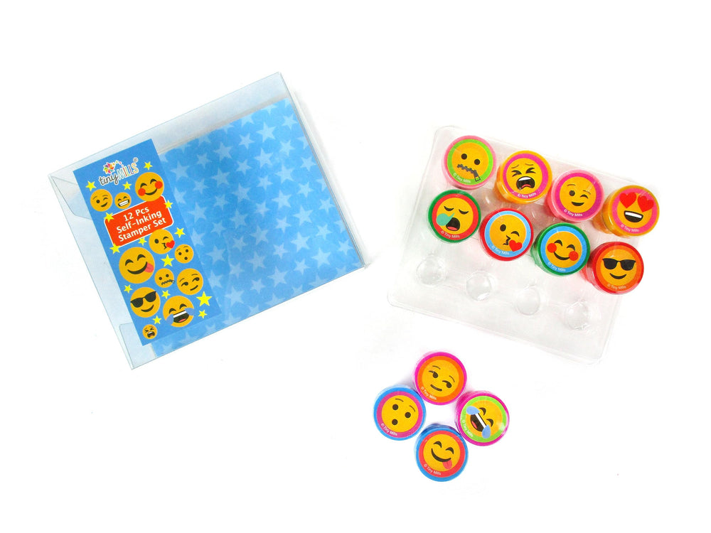 TINYMILLS clear reusable box housing the 12 pre-inked emoji stamps.