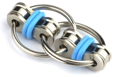 Tom's Fidgets Original Flippy Chain Fidget in blue, held for quiet focus and stress relief.