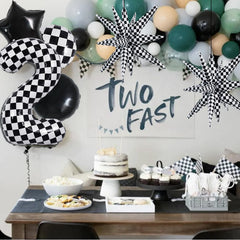 TONIFUL 18-inch black round balloons pair with checkered pieces for contrast.