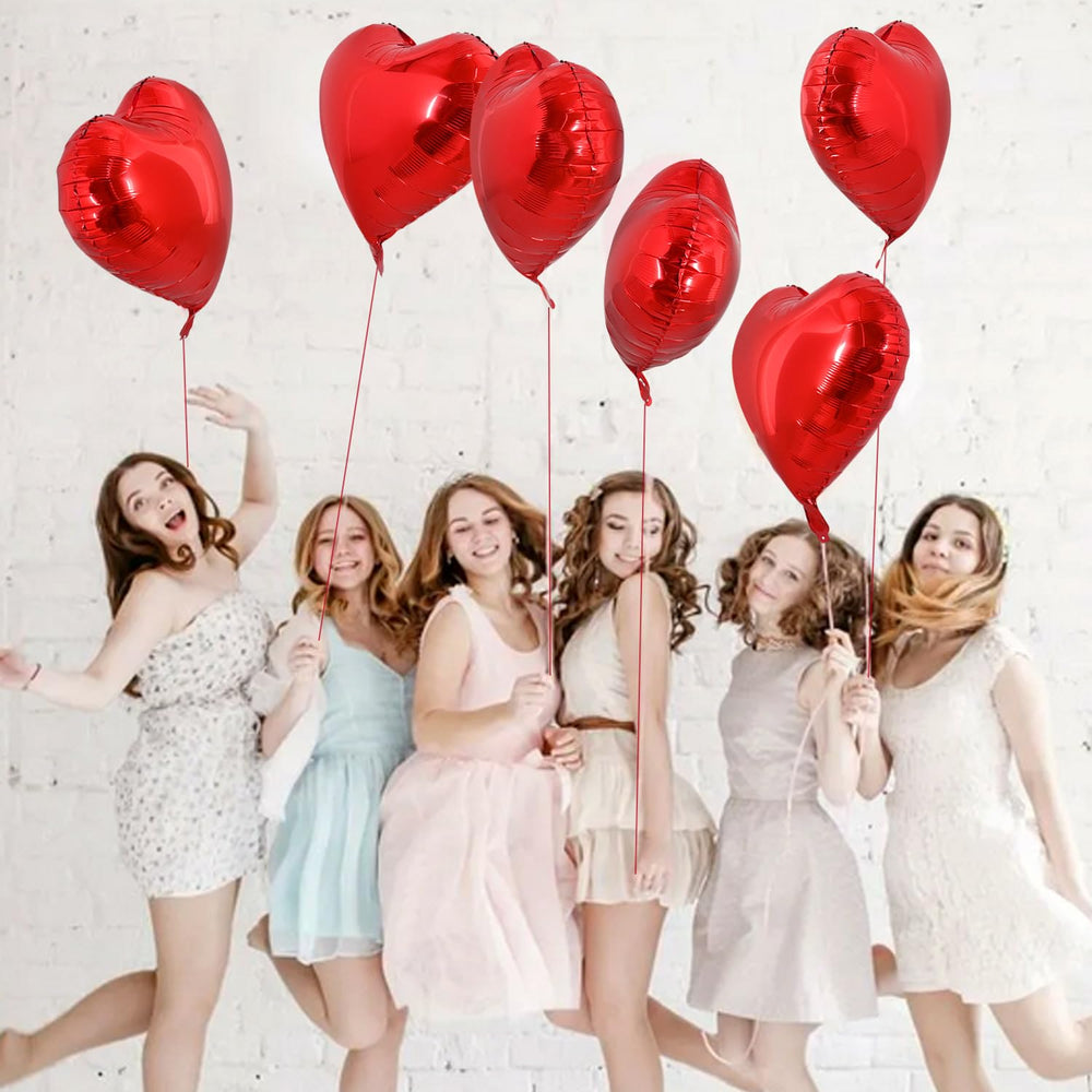 TONIFUL ceiling-draped heart balloons transform spaces with shimmering, reusable foil for events.