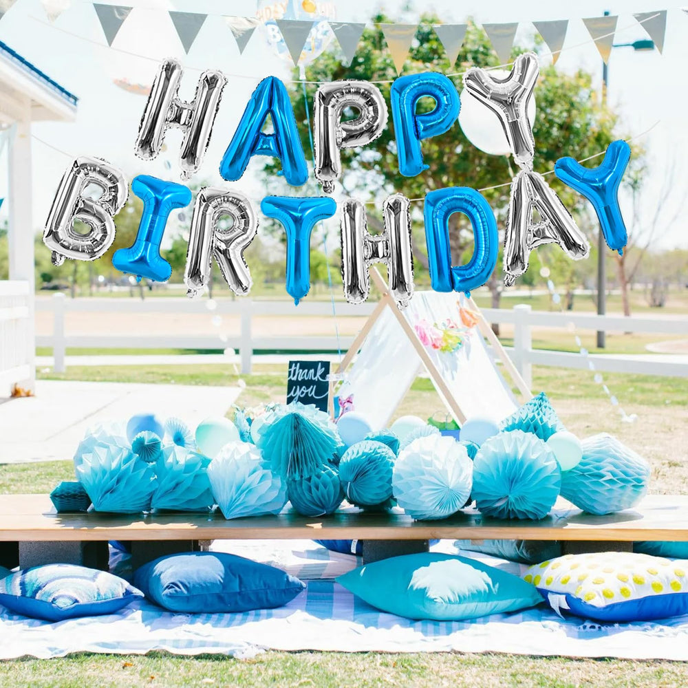 Living room setup featuring TONIFUL navy-silver birthday banner.