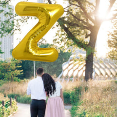 TONIFUL gold Z balloon used as a photo prop for celebrations
