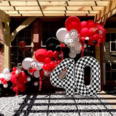 TONIFUL large black and white number balloon makes a striking focal point.