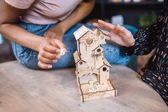 TowerRex Dice Tower table-top accessory enhances gaming ambiance.