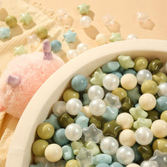 TRENDPLAY Colorful star balls support color recognition and imaginative play.