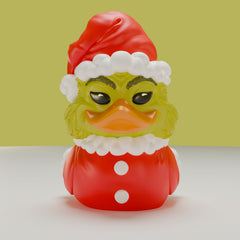 TUBBZ Grinch miniature duck on desk, festive decor and conversation piece.