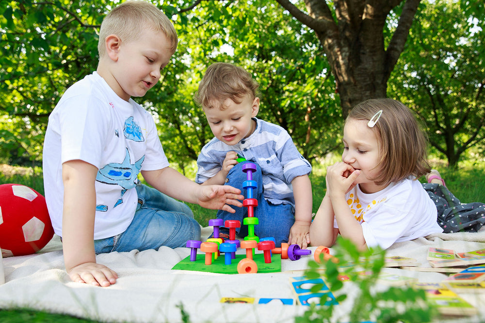 Travel-friendly design supports learning on the go with the Tuddler Peg Board.