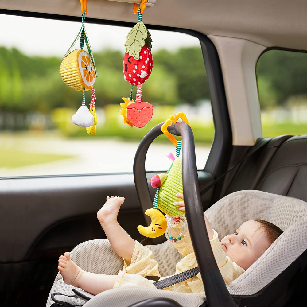 TUMAMA KIDS orange teethers rattle includes soft teethers for soothing gums.