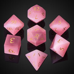 UDIXI Pink Cat's Eye gemstone dice set close-up showing natural textures for tabletop gameplay