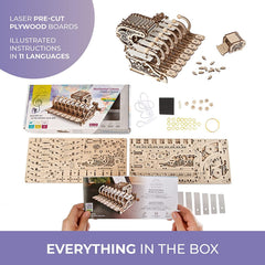 UGEARS Celesta laser-cut pieces spread on a worktable; 573 pieces for immersive building