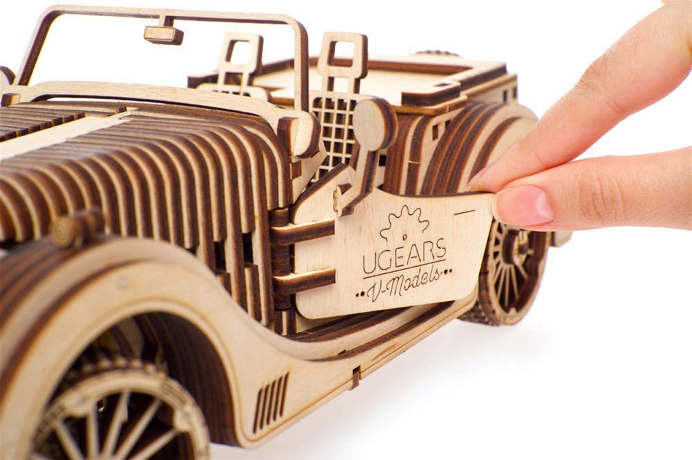 UGEARS VM-01 Roadster plywood closeup emphasizes natural wood texture and premium craft.