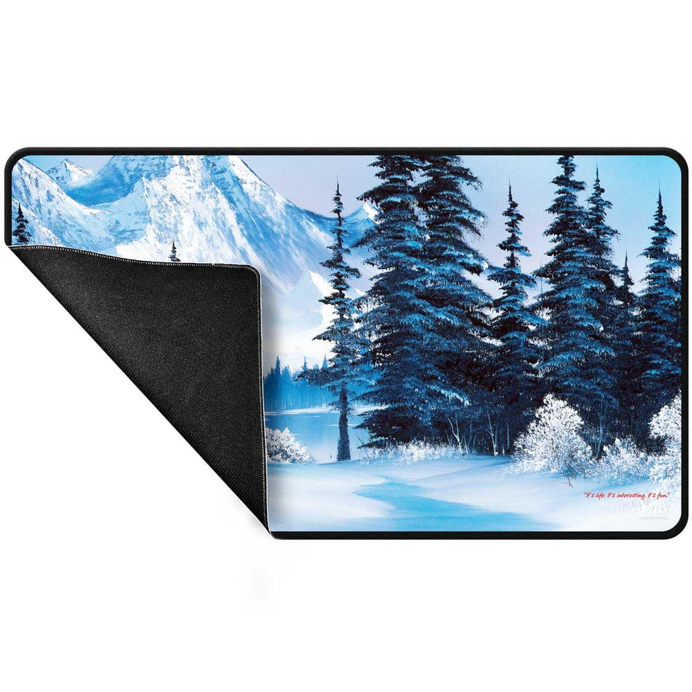Ultra Pro Bob Ross Winter Paradise playmat shows stitched edges for premium feel