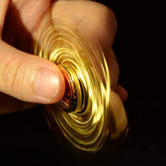 Umnodobn Gold Sphere Spinner in hand demonstrates portable design