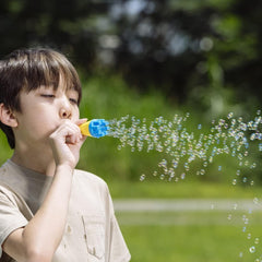 Uncle Bubble Mini Bubble Blower includes non-toxic solution for safe outdoor play.