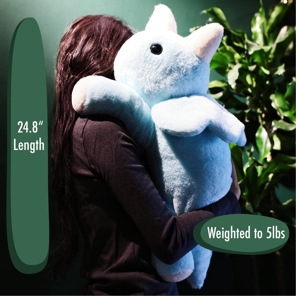 uoozii blue dinosaur weighted plush shown in a cozy nightly cuddle scene.