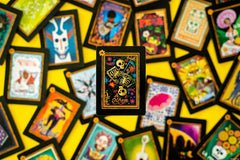 USAOPOLY dia-de-los-muertos theme captures festive cultural vibes.