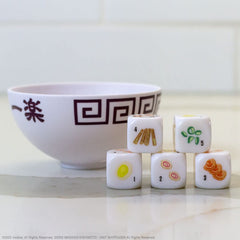 USAOPOLY Naruto Shippuden Yahtzee packaging showcases travel-friendly set.