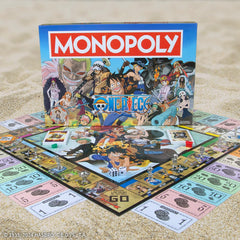 USAOPOLY One Piece rulebook and components laid out clearly for setup.