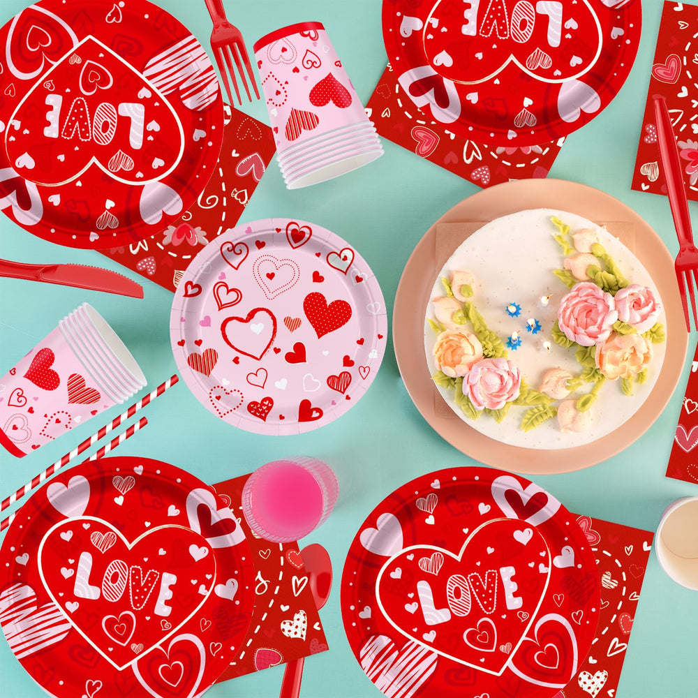 Valentine's Day party supplies tablecloth with red hearts frames the table beautifully.