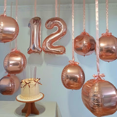 Vibzox rose gold 10-inch foil balloons create charming party accents.