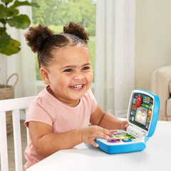 VTech Toddler Tech Laptop light-up emojis spark playful expressions in reflection.