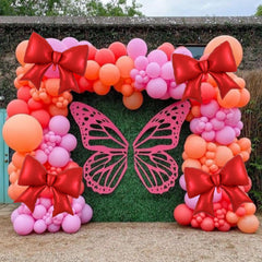 Vuzvuv giant red bow balloons elevating celebratory table or shelf displays