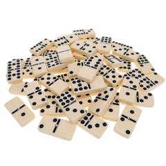 WE Games family game night setup featuring dominoes on a coffee table.