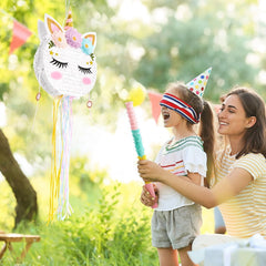WERNNSAI unicorn pinata in use during a playful birthday game.