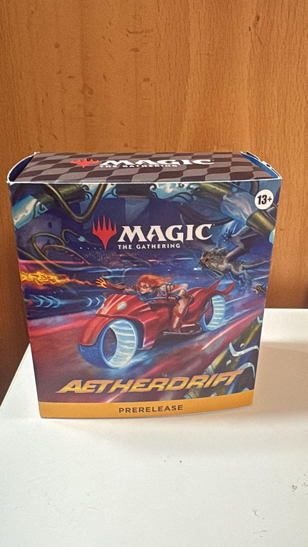 Wizards of the Coast MTG Prerelease Aetherdrift pack unopened, ready for collecting and playing.