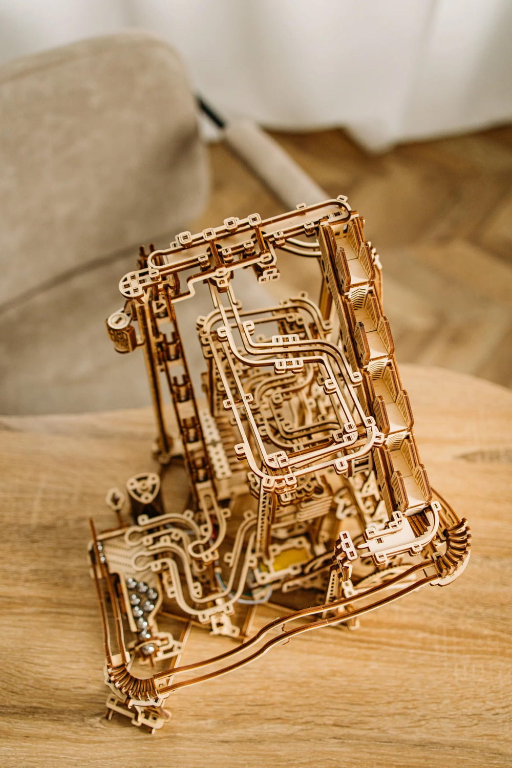 Wood Trick paw-start mechanism offers tactile marble release for precise launches.