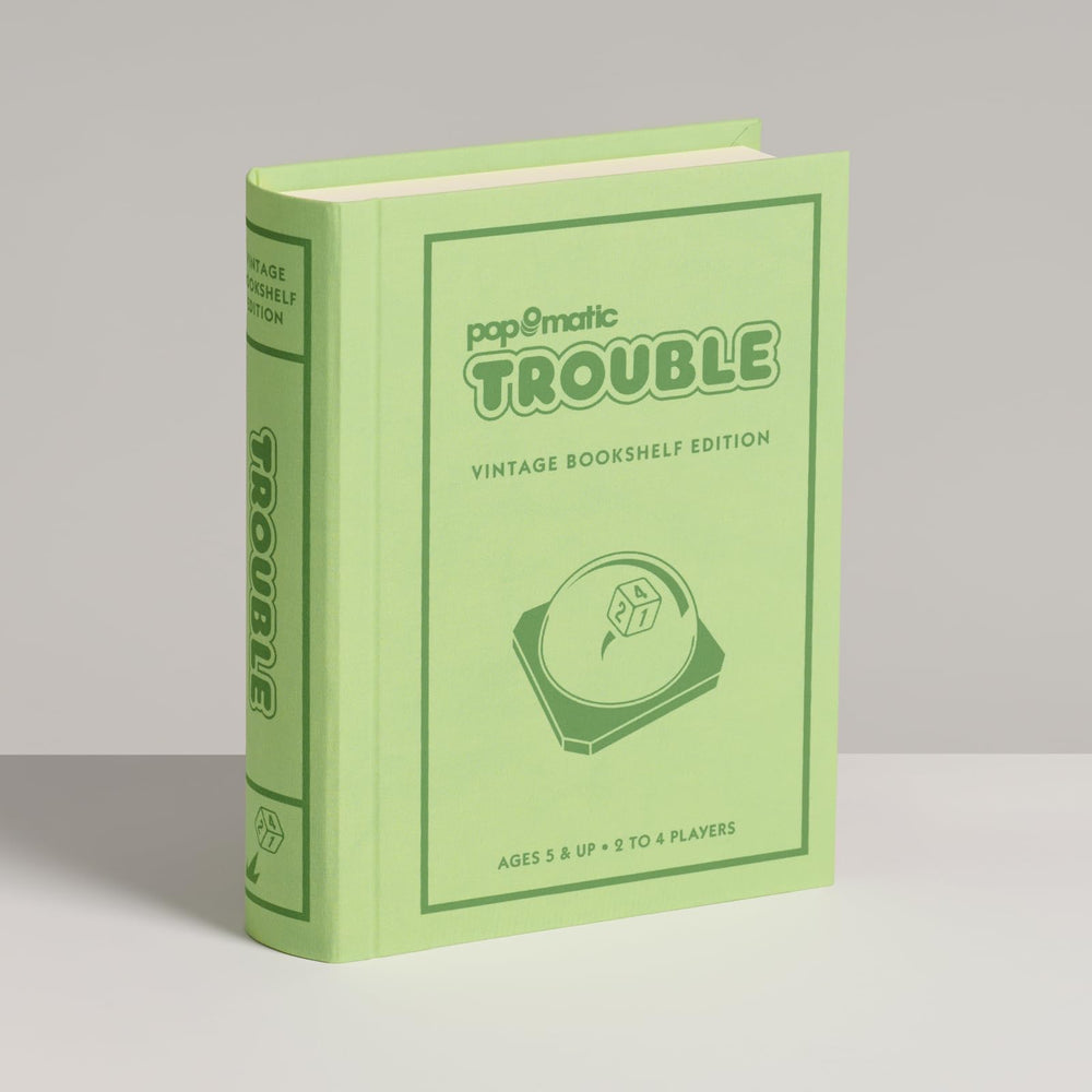 WS Game Company Trouble shelf styling with retro vibe for playful evenings.