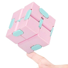 WUQID Infinitycube in macaron pink, closed, discreet stress relief on the go