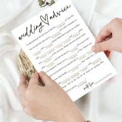 Wybgno wedding icebreaker cards on display with guests chatting and laughing.