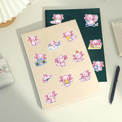 Wyyeleswm Axolotl stickers on a laptop for personalized flair.