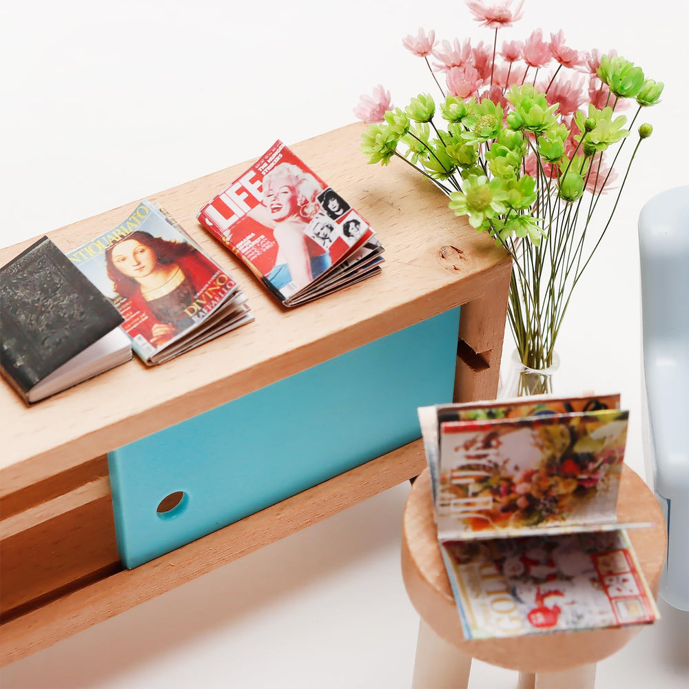 X Hot Popcorn mini books in a living room setup adding color and detail