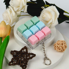 XiawaLangzhuo Keyboard Fidget Toy in hand shows easy carry for travel.