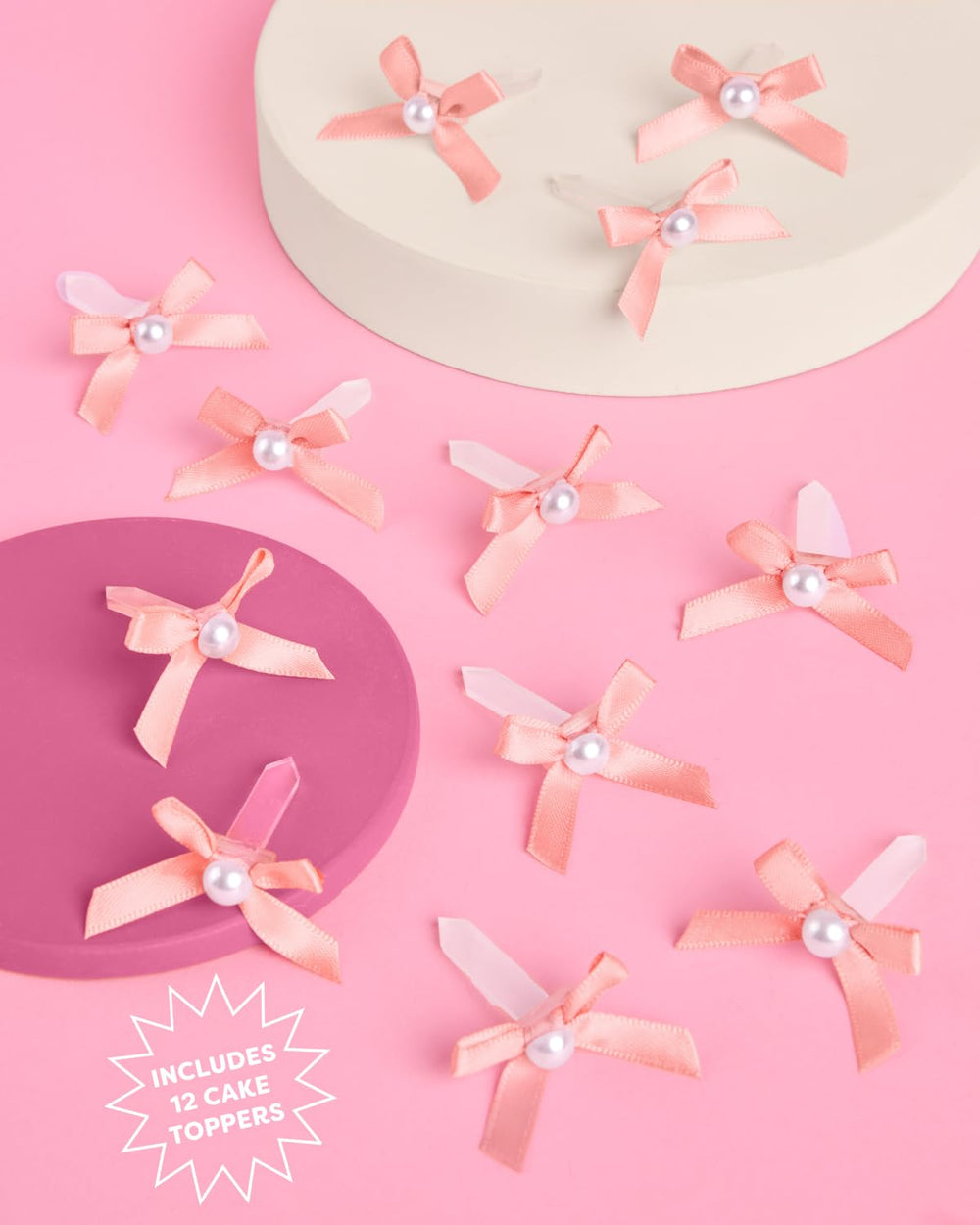 xo Fetti mini pink bows with pearls on a wedding dessert table