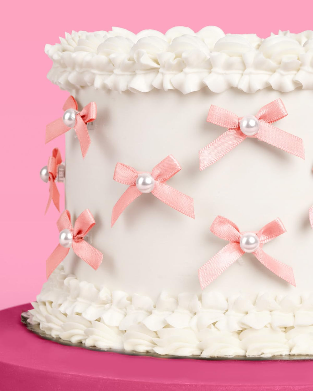 xo Fetti pink bow pearl toppers with clear spikes for easy insertion