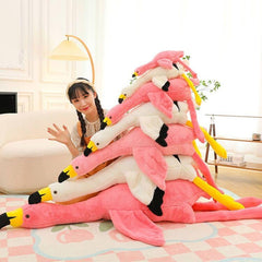 XQEYNT Pink Flamingo Plush Pillow on sofa for quick naps and relaxation