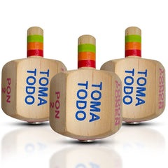 YAJUA Toma Todo Pirinola wood spinner close-up shows handcrafted detail for authentic guest entertainment