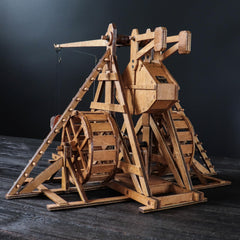 YAQUMW Trebuchet wheel mechanism close-up highlights rolling movement for tabletop play