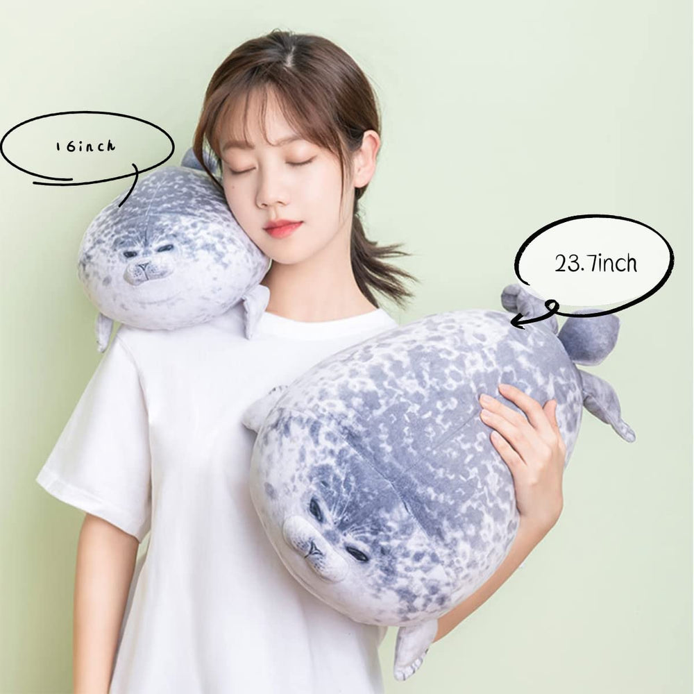 YesGIRL seal plush pillow on bed decor for living spaces.
