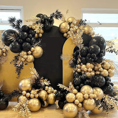 YMSZ black gold balloon arc setup enhances photo-worthy moments.