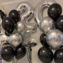 Indoor party decor shot featuring YMSZ black and silver balloons