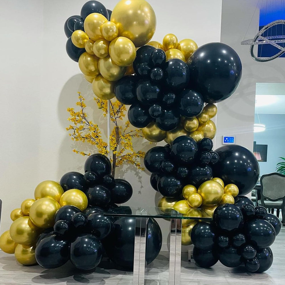 YMSZ party decoration kit creates cohesive black and gold themes.
