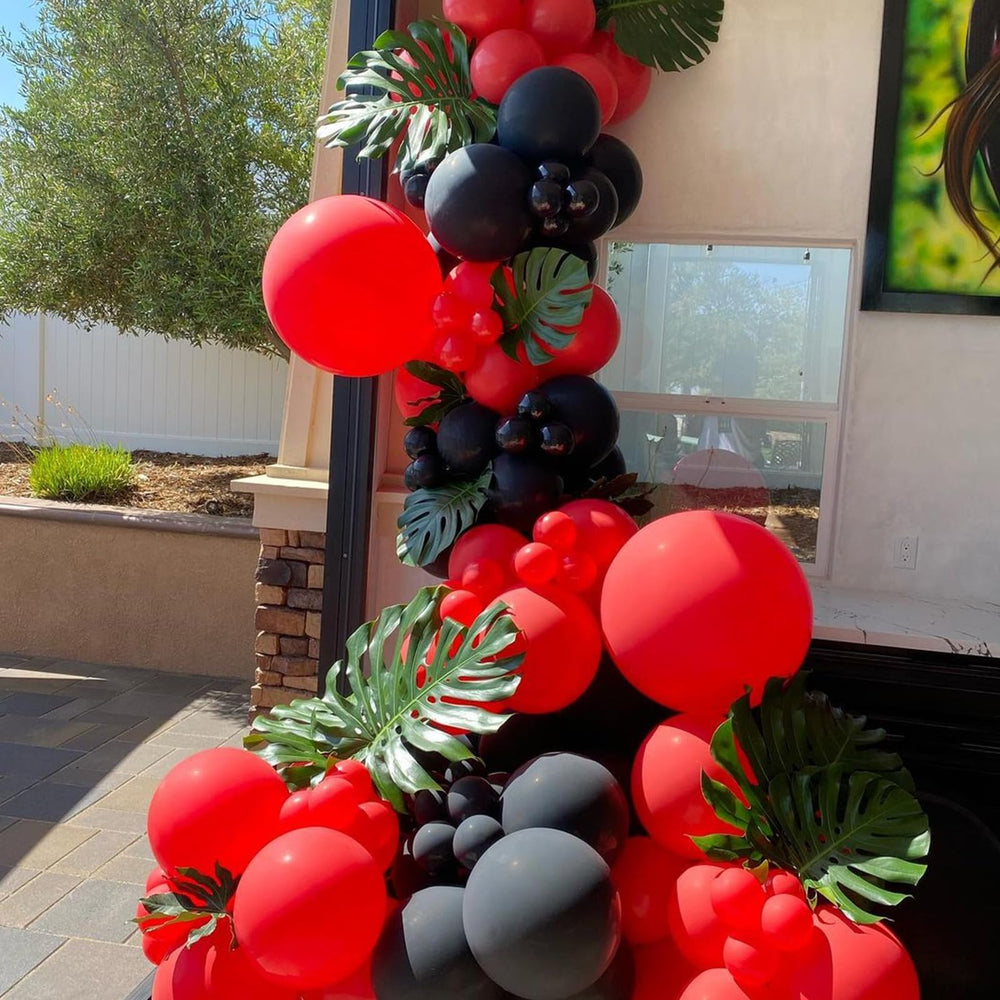 YMSZ red and black balloons arranged into chic party arch.