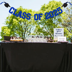 Yochamc Class of 2025 banner hanging on mantel or desk backdrop