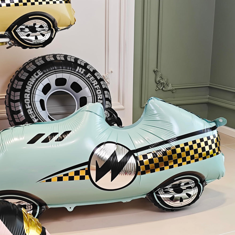 YOIOZAIZAI blue race car balloon as a photo backdrop.