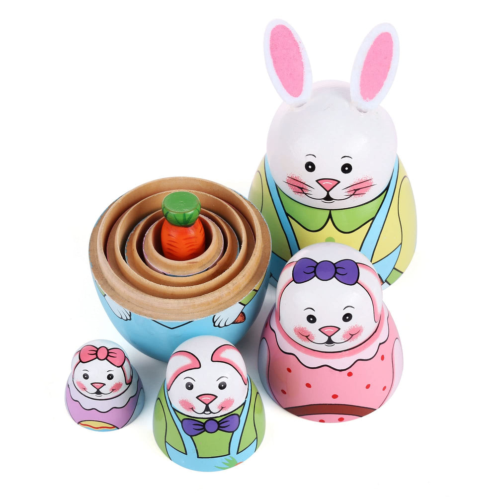 Yoption nesting dolls used as pen and jewelry storage on a desk