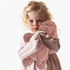 YOUBLEK plush toy in a cozy home decor setting.